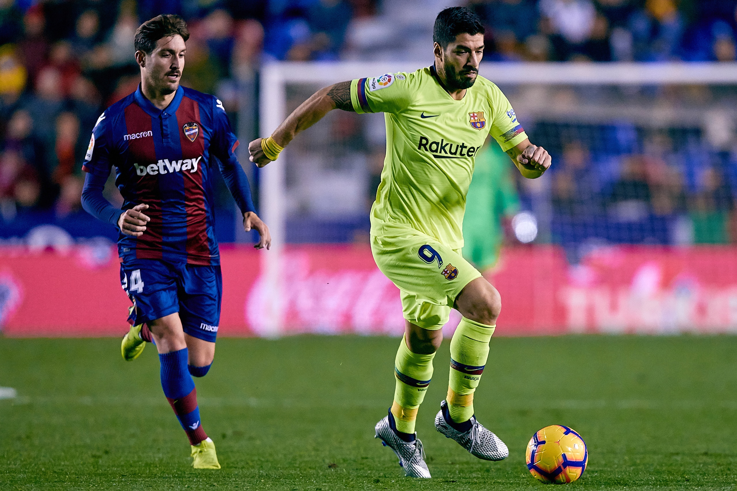 VALENCIA, SPAIN - DECEMBER 16: Luis Suarez (R) of FC Barcelona competes for the ball with Jose Angel Gomez Campana of Levante UD during the La Liga match between Levante UD and FC Barcelona at Ciutat de Valencia on December 16, 2018 in Valencia, Spain. (P
