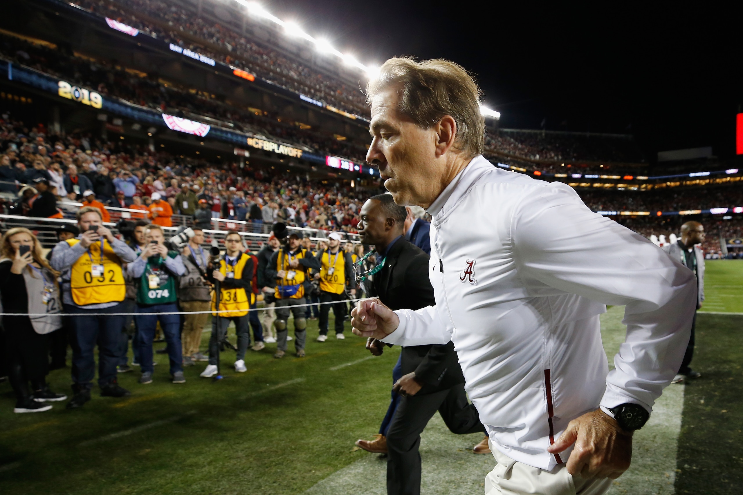 SANTA CLARA, CA - JANUARY 07:  Head coach Nick Saban of the Alabama Crimson Tide is escorted off the field after his teams 44-16 loss to the Clemson Tigers in the CFP National Championship presented by AT&T at Levi's Stadium on January 7, 2019 in Santa Cl