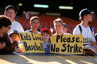 OAKLAND, CA - AUGUST 11:  Fans hold up signs in protest of the baseball strike prior to the game between the Seattle Mariners and the Oakland Athletics at the Oakland Coliseum on August 11, 1994 in Oakland, California.  (Photo by Brad Mangin/MLB Photos vi