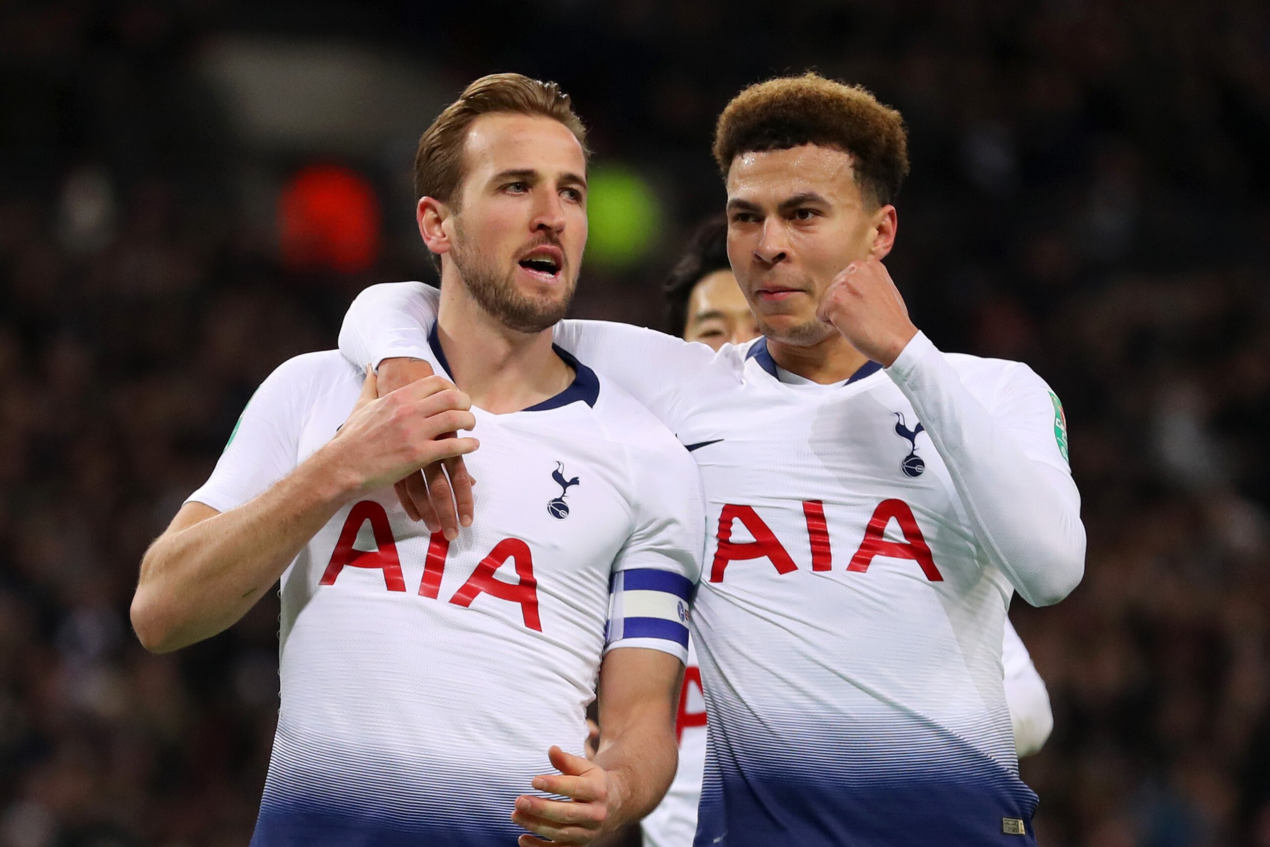 LONDON, ENGLAND - JANUARY 08:  Harry Kane of Tottenham Hotspur celebrates after scoring his team's first goal with Dele Alli of Tottenham Hotspur during the Carabao Cup Semi-Final First Leg match between Tottenham Hotspur and Chelsea at Wembley Stadium on