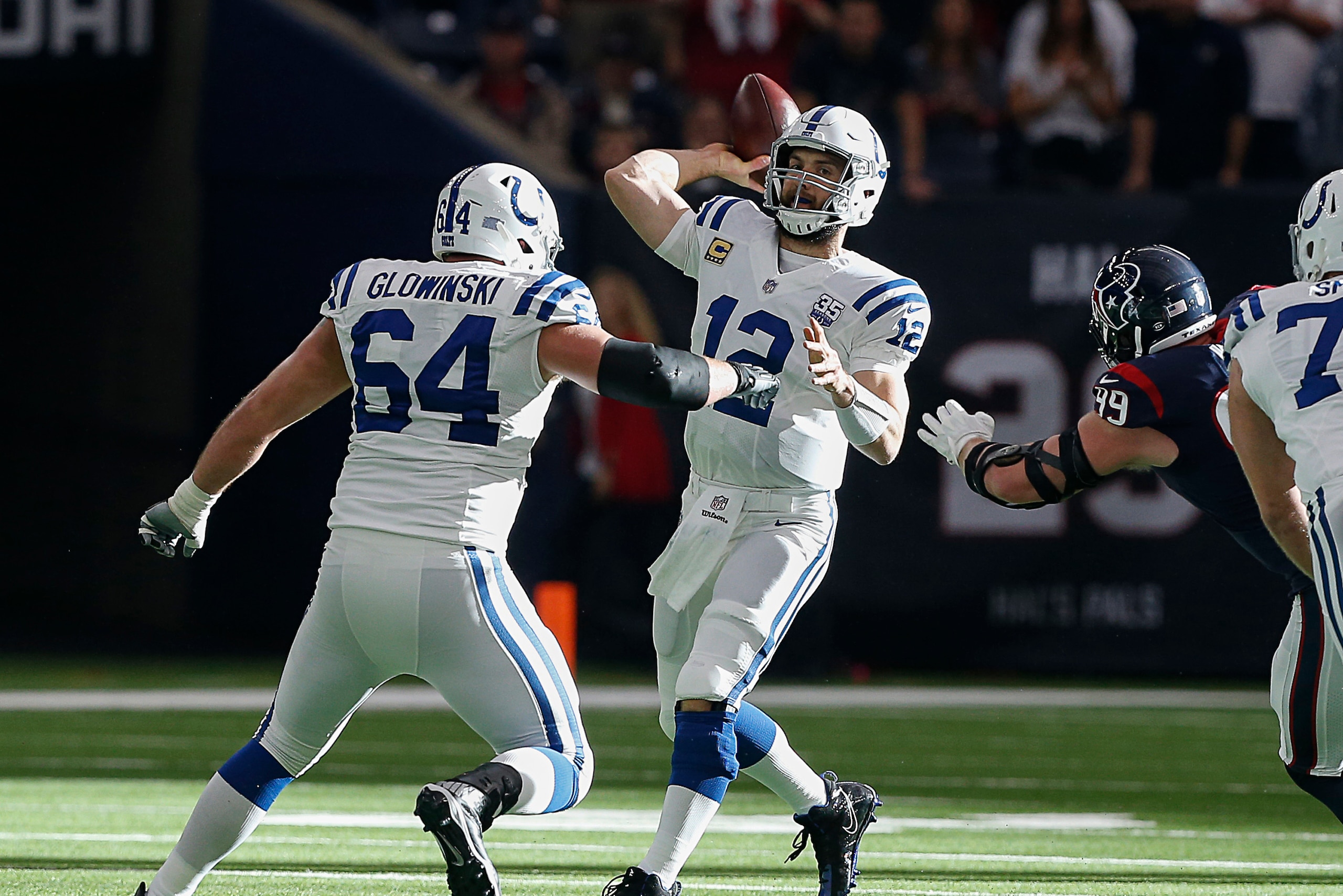 HOUSTON, TEXAS - JANUARY 05: Andrew Luck #12 of the Indianapolis Colts looks for a receiver during the first quarter against the Houston Texans during the Wild Card Round at NRG Stadium on January 05, 2019 in Houston, Texas. (Photo by Bob Levey/Getty Imag