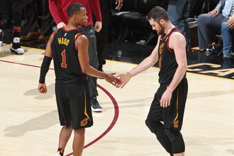 CLEVELAND, OH - APRIL 18: Rodney Hood #1 and Kevin Love #0 of the Cleveland Cavaliers exchange a high five  in Game Two of Round One of the 2018 NBA Playoffs against the Indiana Pacerson April 18, 2018 at Quicken Loans Arena in Cleveland, Ohio.  NOTE TO U