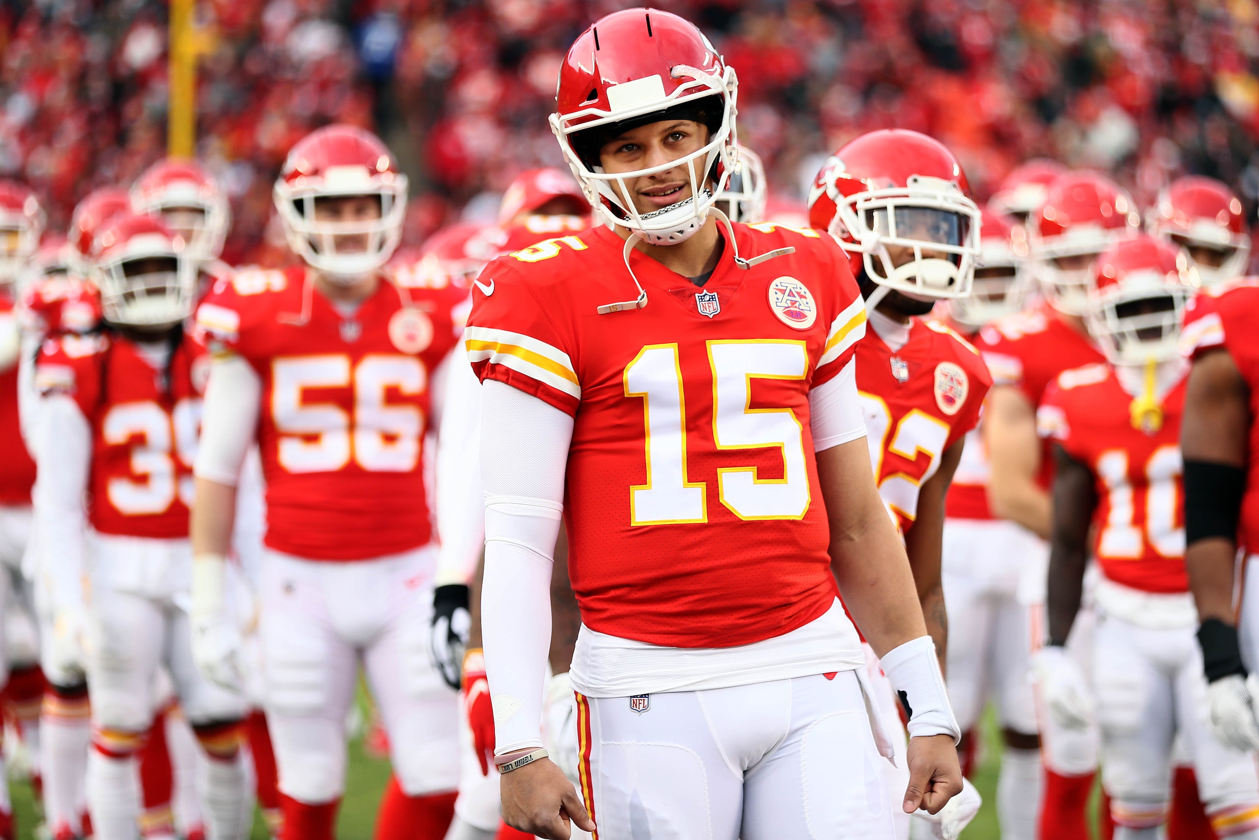 KANSAS CITY, MISSOURI - DECEMBER 30:  Quarterback Patrick Mahomes #15 of the Kansas City Chiefs greets teammates during player introductions prior to the game against the Oakland Raiders at Arrowhead Stadium on December 30, 2018 in Kansas City, Missouri. 