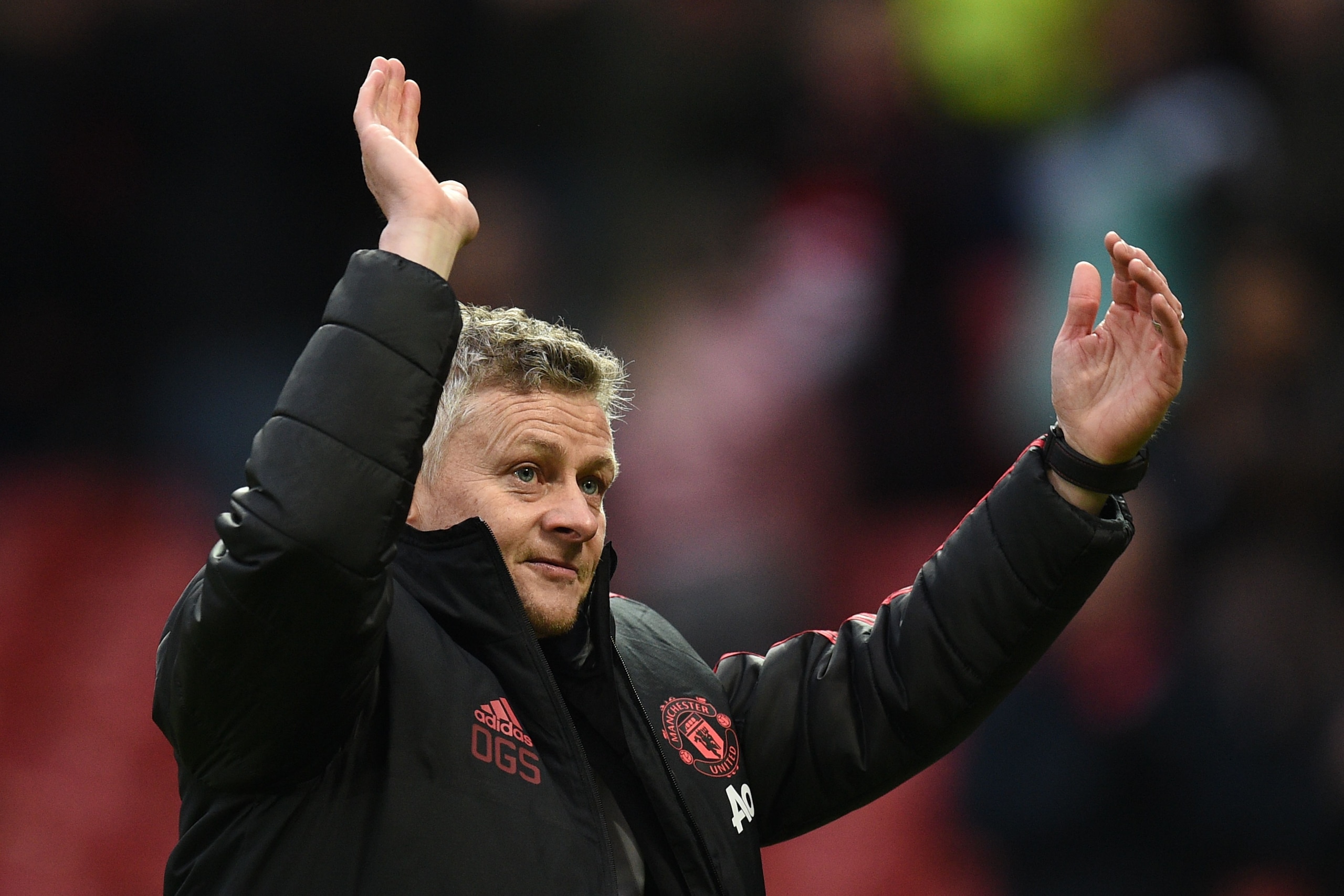 Manchester United's  Norwegian caretaker manager Ole Gunnar Solskjaer waves to the crowd at the end of the English FA Cup third round football match between Manchester United and Reading at Old Trafford in Manchester, north west England, on January 5, 201