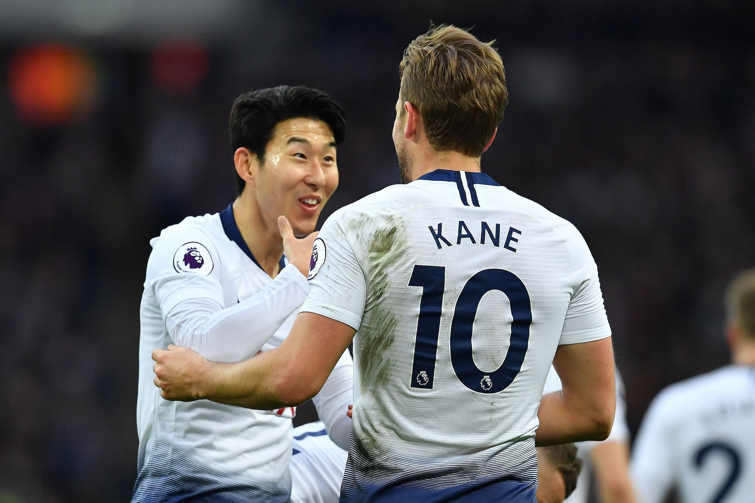 Tottenham Hotspur's English striker Harry Kane (R) celebrates scoring the opening goal with Tottenham Hotspur's South Korean striker Son Heung-Min during the English Premier League football match between Tottenham Hotspur and Wolverhampton Wanderers at We