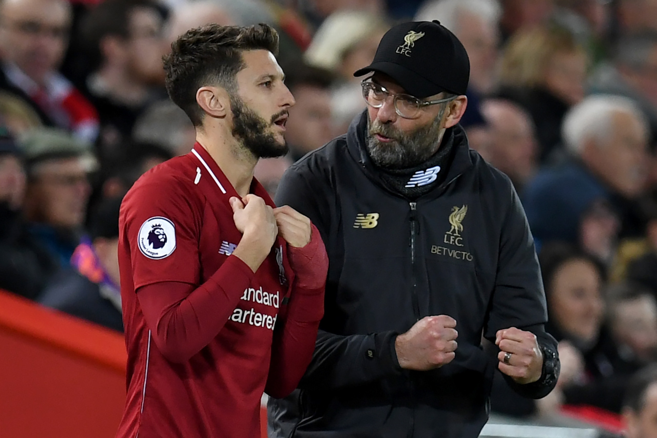Liverpool's German manager Jurgen Klopp (R) talks with Liverpool's English midfielder Adam Lallana as he waits to be substituted on during the English Premier League football match between Liverpool and Arsenal at Anfield in Liverpool, north west England Liverpool's German manager Jurgen Klopp (R) talks with Liverpool's English midfielder Adam Lallana as he waits to be substituted on during the English Premier League football match between Liverpool and Arsenal at Anfield in Liverpool, north west England
