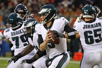 CHICAGO, IL - JANUARY 06:  Nick Foles #9 of the Philadelphia Eagles rolls out to look for a receiver against the Chicago Bears during an NFC Wild Card playoff game at Soldier Field on January 6, 2019 in Chicago, Illinois. The Eagles defeated the Bears 16-