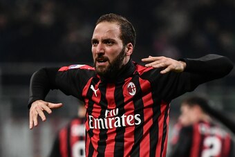 AC Milan's Argentine forward Gonzalo Higuain celebrates after scoring 2-1 during the Italian Serie A football match AC Milan vs Spal on December 29, 2018 at San Siro stadium in Milan. (Photo by Marco BERTORELLO / AFP) (Photo credit should read MARC AC Milan's Argentine forward Gonzalo Higuain celebrates after scoring 2-1 during the Italian Serie A football match AC Milan vs Spal on December 29, 2018 at San Siro stadium in Milan. (Photo by Marco BERTORELLO / AFP) (Photo credit should read MARC