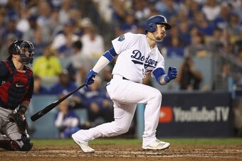 LOS ANGELES, CA - OCTOBER 26:  Yasmani Grandal #9 of the Los Angeles Dodgers singles during the fifth inning against the Boston Red Sox in Game Three of the 2018 World Series at Dodger Stadium on October 26, 2018 in Los Angeles, California.  (Photo by Ezr