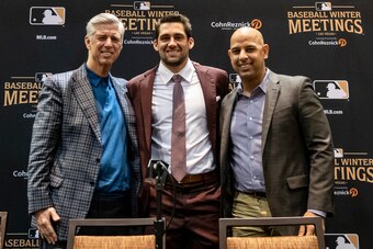LAS VEGAS, NV - DECEMBER 10: President of Baseball Operations Dave Dombrowski, Nathan Eovaldi #17 of the Boston Red Sox and manager Alex Cora of the Boston Red Sox pose for a photograph during a press conference announcing Eovaldi's contract extension at 
