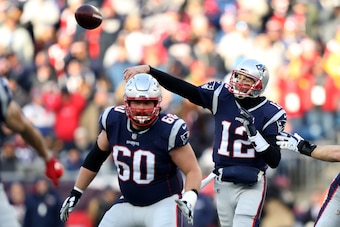 FOXBOROUGH, MASSACHUSETTS - JANUARY 13: Tom Brady #12 of the New England Patriots throws during the second quarter in the AFC Divisional Playoff Game against the Los Angeles Chargers at Gillette Stadium on January 13, 2019 in Foxborough, Massachusetts. (P