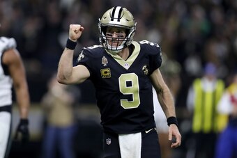 NEW ORLEANS, LOUISIANA - JANUARY 13:  Drew Brees #9 of the New Orleans Saints celebrates his second quarter touchdown pass against the Philadelphia Eagles in the NFC Divisional Playoff Game at Mercedes Benz Superdome on January 13, 2019 in New Orleans, Lo