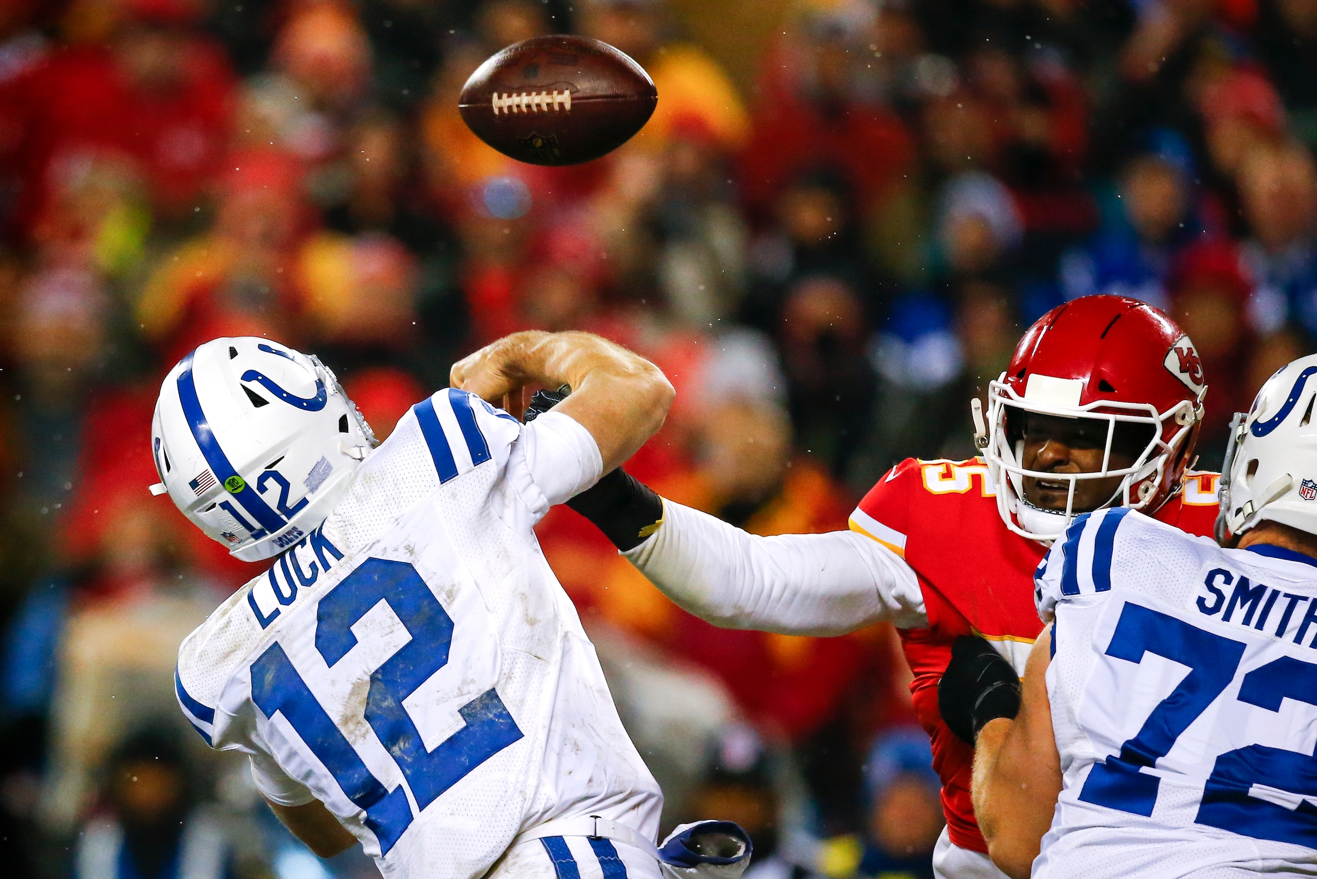 KANSAS CITY, MO - JANUARY 12: Outside linebacker Dee Ford #55 of the Kansas City Chiefs jars the football out of the hand of quarterback Andrew Luck #12 of the Indianapolis Colts during the AFC Divisional Playoff at Arrowhead Stadium on January 12, 2019 i KANSAS CITY, MO - JANUARY 12: Outside linebacker Dee Ford #55 of the Kansas City Chiefs jars the football out of the hand of quarterback Andrew Luck #12 of the Indianapolis Colts during the AFC Divisional Playoff at Arrowhead Stadium on January 12, 2019 i
