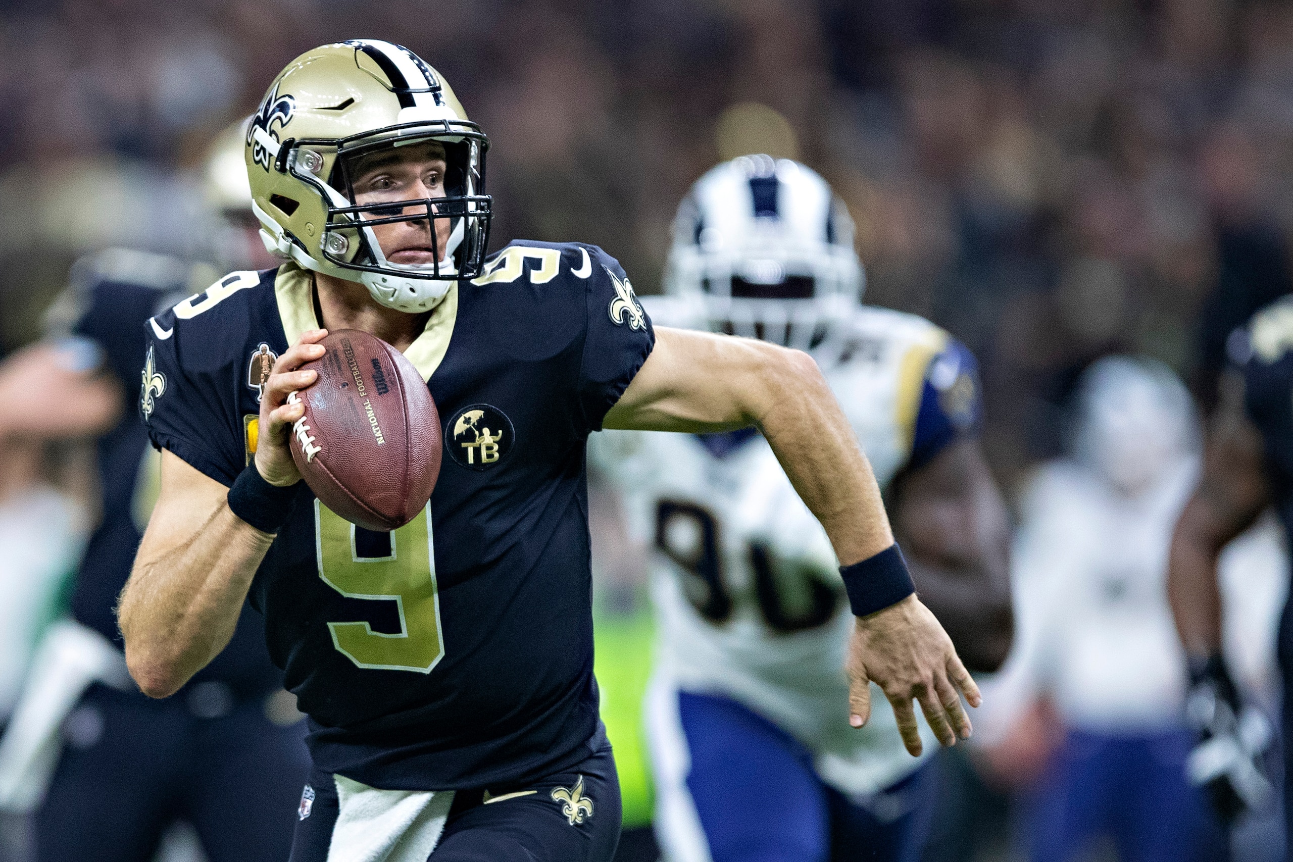 NEW ORLEANS, LA - NOVEMBER 4: Drew Brees #9 of the New Orleans Saints runs the ball during a game against the Los Angeles Rams at Mercedes-Benz Superdome on November 4, 2018 in New Orleans, Louisiana. The Saints defeated the Rams 45-35. (Photo by Wesle NEW ORLEANS, LA - NOVEMBER 4: Drew Brees #9 of the New Orleans Saints runs the ball during a game against the Los Angeles Rams at Mercedes-Benz Superdome on November 4, 2018 in New Orleans, Louisiana. The Saints defeated the Rams 45-35. (Photo by Wesle