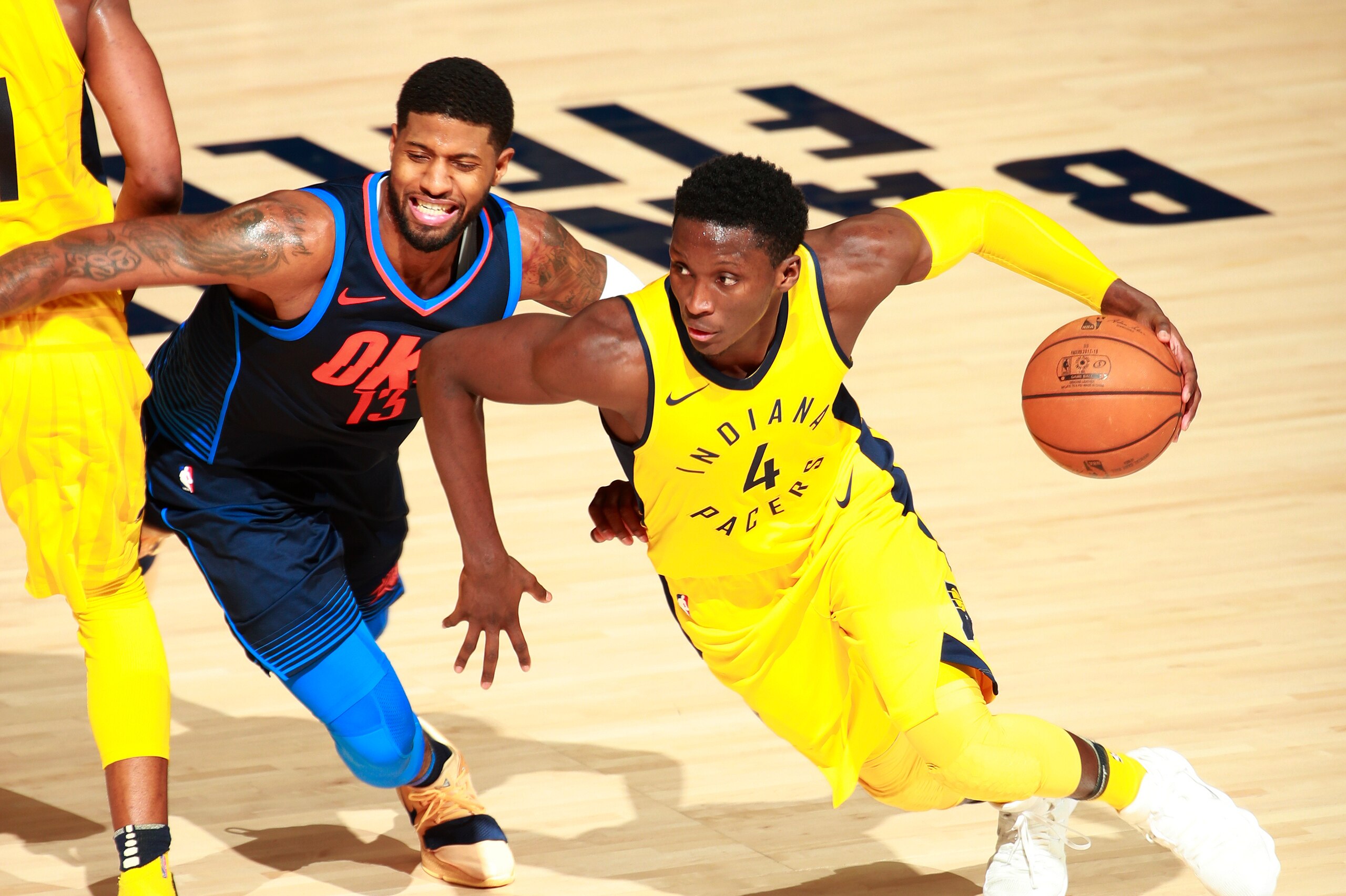 INDIANAPOLIS, IN - DECEMBER 13: Victor Oladipo #4 of the Indiana Pacers handles the ball against Paul George #13 of the Oklahoma City Thunder on December 13, 2017 at Bankers Life Fieldhouse in Indianapolis, Indiana. NOTE TO USER: User expressly acknowled INDIANAPOLIS, IN - DECEMBER 13: Victor Oladipo #4 of the Indiana Pacers handles the ball against Paul George #13 of the Oklahoma City Thunder on December 13, 2017 at Bankers Life Fieldhouse in Indianapolis, Indiana. NOTE TO USER: User expressly acknowled