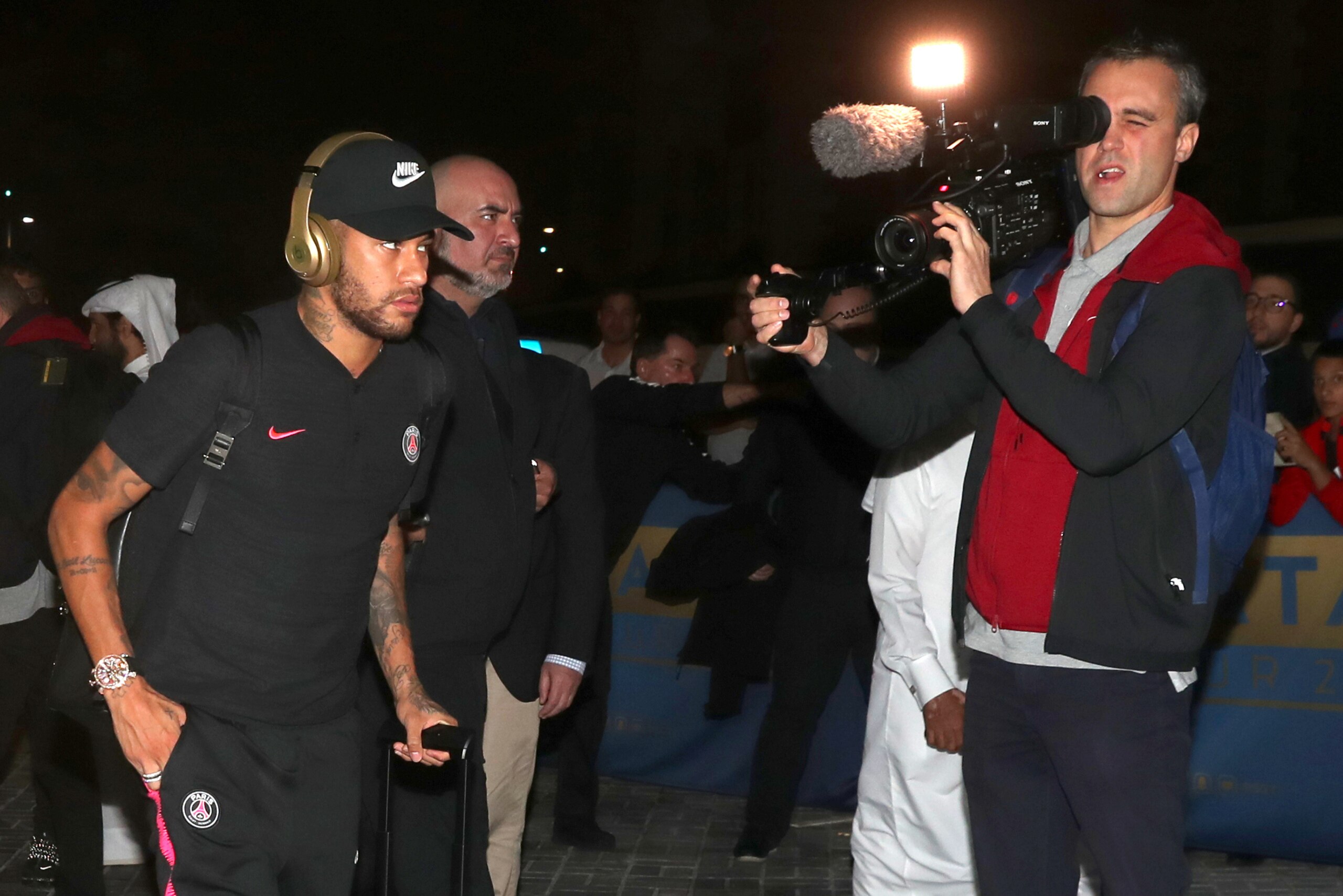 Paris Saint-Germain's Brazilian forward Neymar is greeted by fans as he leaves Doha's International Airport where the French football team arrived to take part in the Aspire Academy winter training camp on January 13, 2019. (Photo by KARIM JAAFAR / AFP) Paris Saint-Germain's Brazilian forward Neymar is greeted by fans as he leaves Doha's International Airport where the French football team arrived to take part in the Aspire Academy winter training camp on January 13, 2019. (Photo by KARIM JAAFAR / AFP)