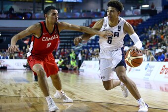 ST CATHARINES, ON - JUNE 16:  Quentin Grimes #6 of the United States dribbles the ball as Addison Patterson #9 of Canada defends during the Gold Medal final of the FIBA U18 Americas Championship at the Meridian Centre on June 16, 2018 in St. Catharines, C