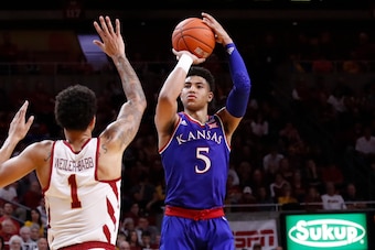 AMES, IA - JANUARY 5: Quentin Grimes #5 of the Kansas Jayhawks takes a shot as Nick Weiler-Babb #1 of the Iowa State Cyclones blocks in the second half of play at Hilton Coliseum on January 5, 2019 in Ames, Iowa. The Iowa State Cyclones won 77-60 over the