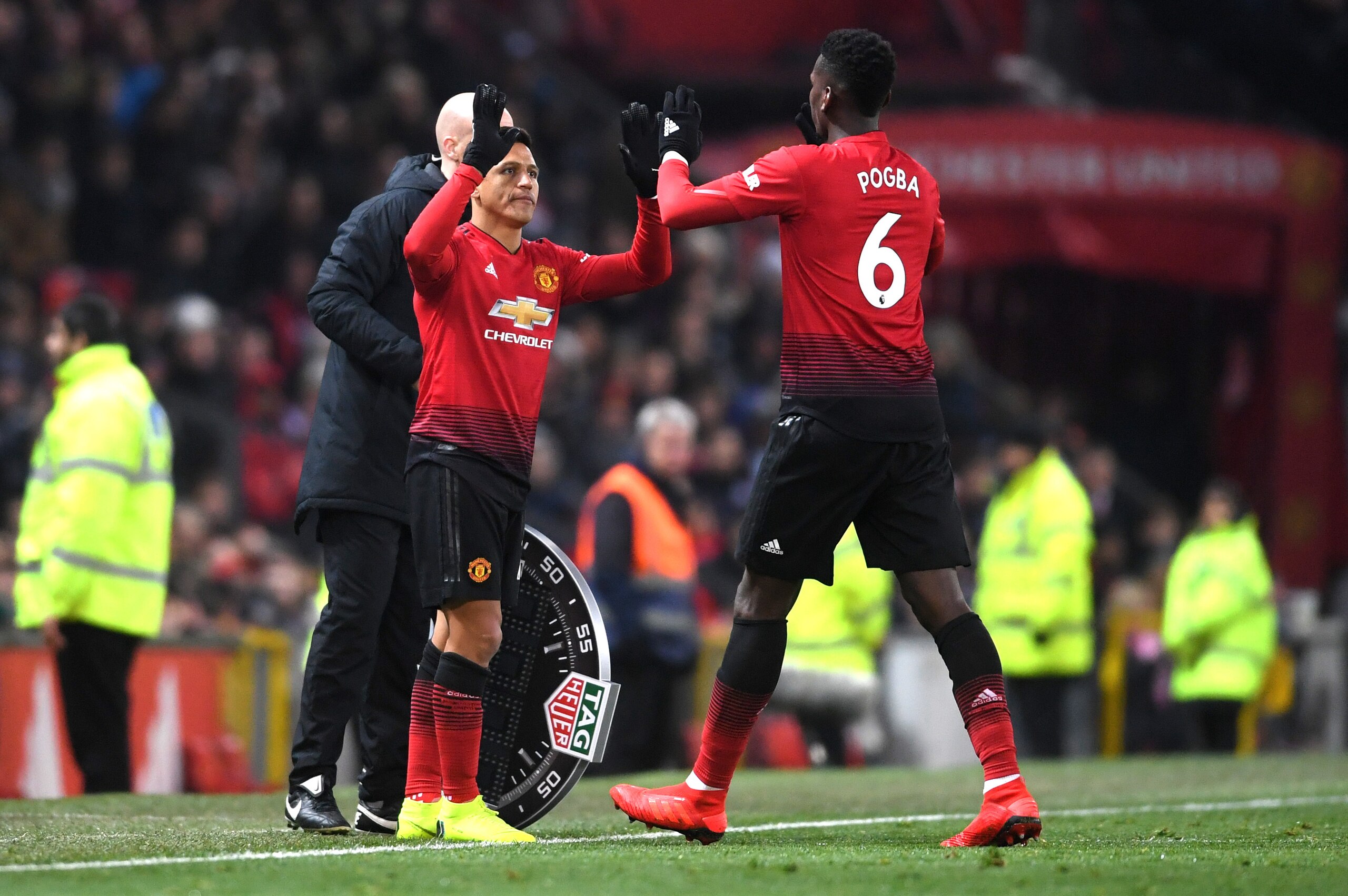 MANCHESTER, ENGLAND - NOVEMBER 24:  Paul Pogba is substituted and replaced by Alexis Sanchez of Manchester United during the Premier League match between Manchester United and Crystal Palace at Old Trafford on November 24, 2018 in Manchester, United Kingd