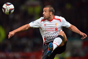 Liverpool's Spanish defender Jose Enrique controls the ball during the English League Cup football match between Manchester United and Liverpool at Old Trafford in Manchester, north-west England on September 25, 2013. AFP PHOTO/Paul Ellis - RESTRICTED TO 