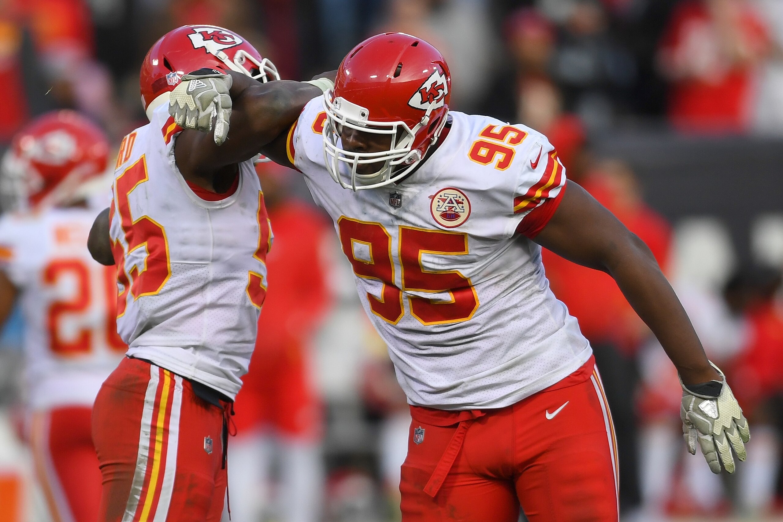 OAKLAND, CA - DECEMBER 02:  Dee Ford #55 and Chris Jones #95 of the Kansas City Chiefs celebrates after they sacked the quarterback against the Oakland Raiders durin the second half of their NFL football game at Oakland-Alameda County Coliseum on December