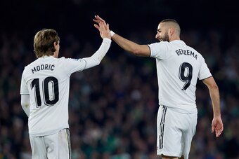 SEVILLE, SPAIN - JANUARY 13: Luka Modric of Real Madrid celebrates after scoring his team's first goal with his teammate Karim Benzema during the La Liga match between Real Betis Balompie and Real Madrid CF at Estadio Benito Villamarin on January 13, 2019
