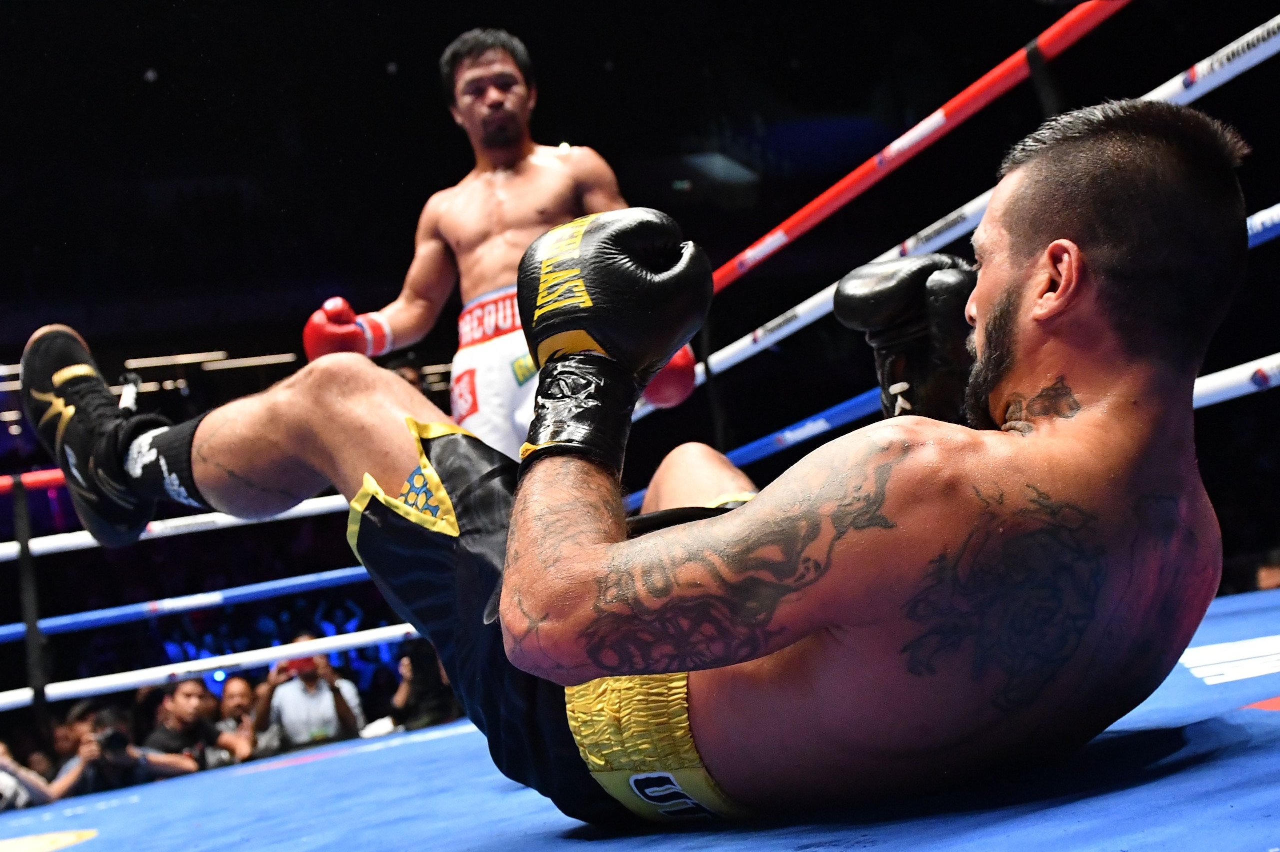 TOPSHOT - Argentina's Lucas Matthysse reacts after he was knocked down by Philippines' Manny Pacquiao during their world welterweight boxing championship bout at Axiata Arena in Kuala Lumpur on July 15, 2018. (Photo by Mohd RASFAN / AFP)        (Photo cre