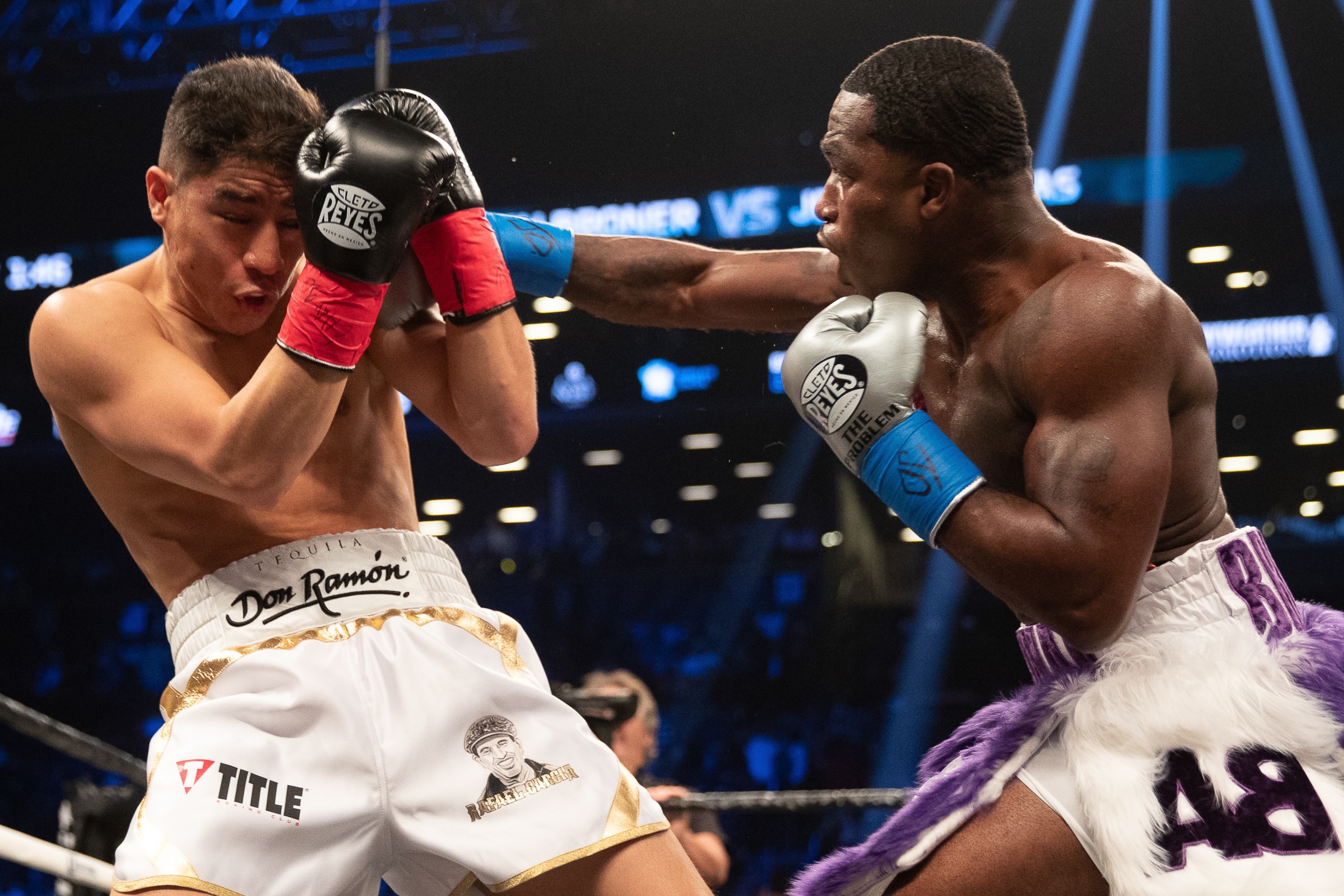 BROOKLYN, NY - APRIL 21: Adrien Broner (Purple/White) lands a right hand against Jessie Vargas at the Barclays Center on April 21, 2018 in the Brooklyn borough of New York City. The fight was ruled a majority draw. (Photo by Edward Diller/Getty Images)
