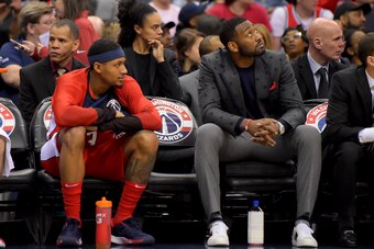 WASHINGTON, DC - DECEMBER 29: Bradley Beal #3 of the Washington Wizards and John Wall #2 of the Washington Wizards sit on the bench during the first half against the Charlotte Hornets at Capital One Arena on December 29, 2018 in Washington, DC. NOTE TO US