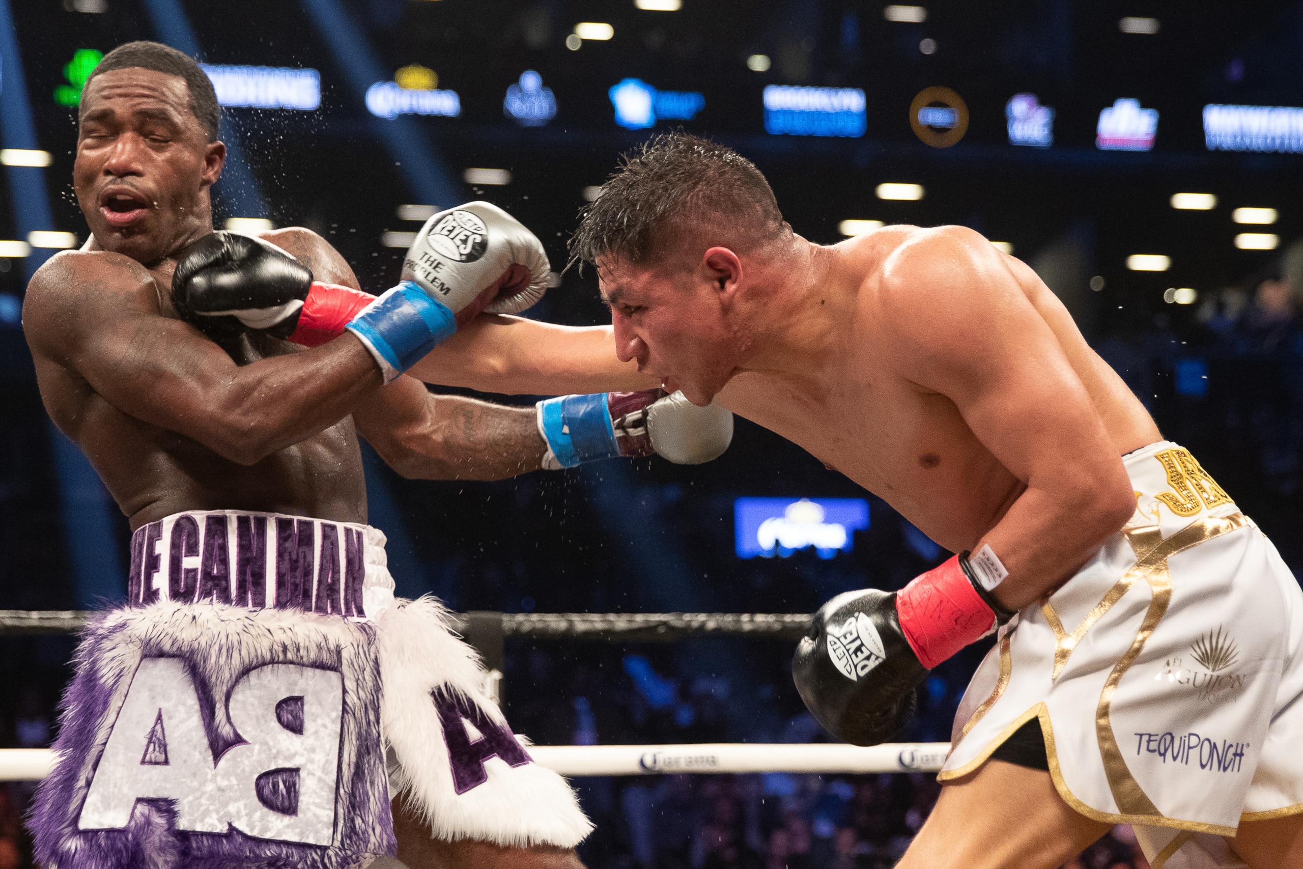 BROOKLYN, NY - APRIL 21: Jessie Vargas (White/Gold) lands a right hand against Adrien Broner (Purple/White) at the Barclays Center on April 21, 2018 in the Brooklyn borough of New York City. The fight was ruled a majority draw. (Photo by Edward Diller/Get