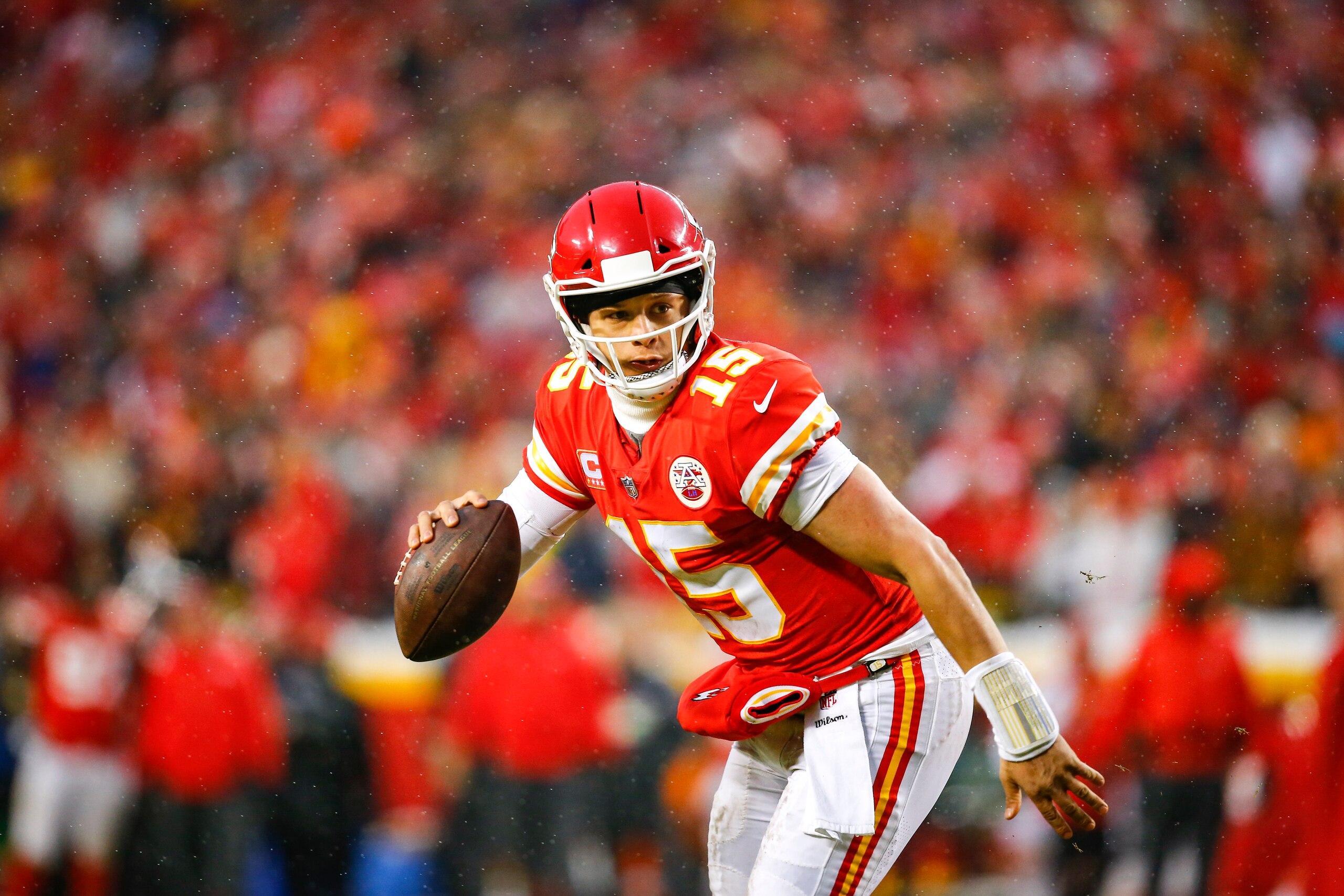 KANSAS CITY, MO - JANUARY 12: Quarterback Patrick Mahomes #15 of the Kansas City Chiefs rolls out on a pass play in the AFC Divisional Playoff against the Indianapolis Colts at Arrowhead Stadium on January 12, 2019 in Kansas City, Missouri. (Photo by Davi KANSAS CITY, MO - JANUARY 12: Quarterback Patrick Mahomes #15 of the Kansas City Chiefs rolls out on a pass play in the AFC Divisional Playoff against the Indianapolis Colts at Arrowhead Stadium on January 12, 2019 in Kansas City, Missouri. (Photo by Davi