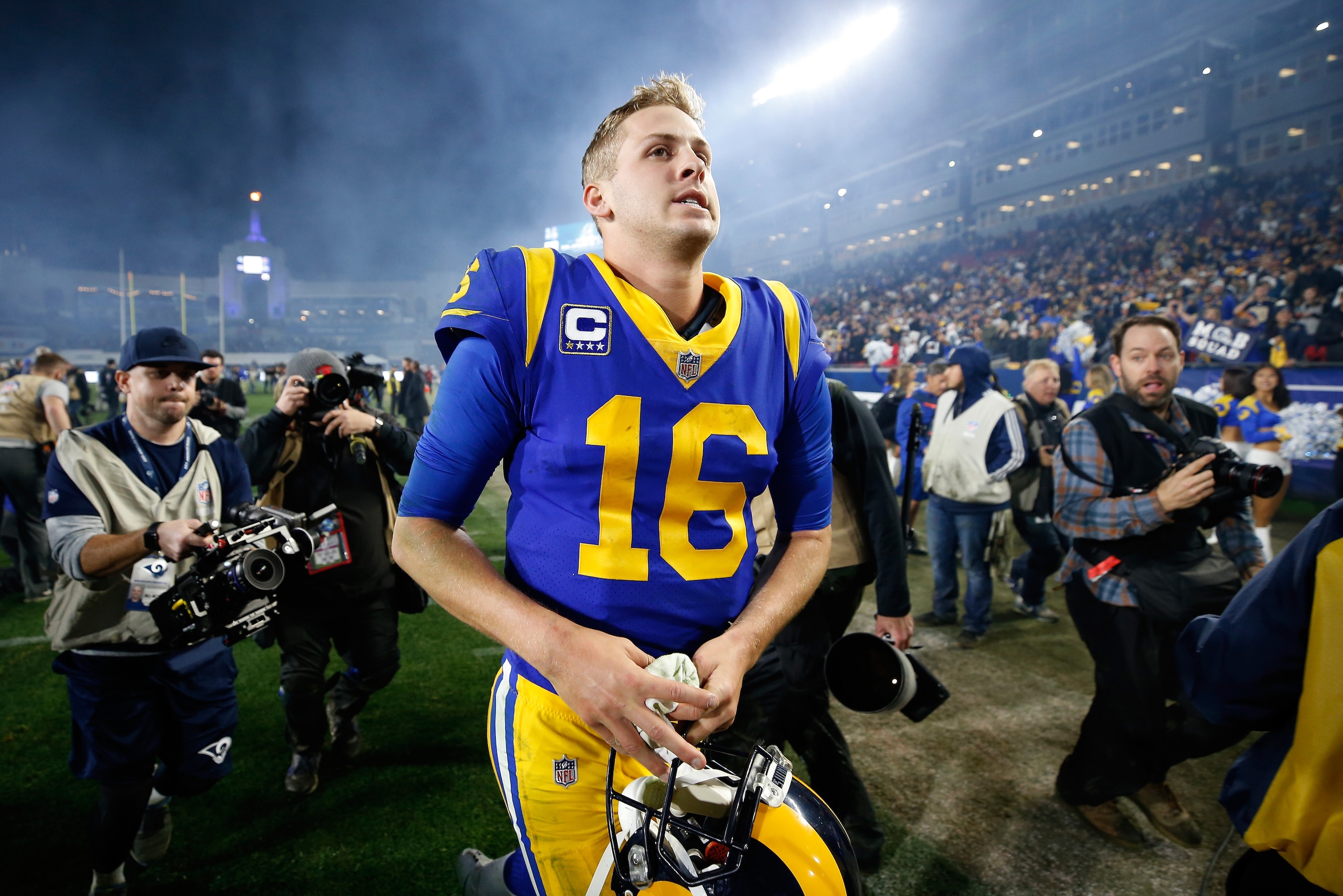 LOS ANGELES, CA - JANUARY 12: Jared Goff #16 of the Los Angeles Rams runs off the field after defeating the Dallas Cowboys in the NFC Divisional Playoff game at Los Angeles Memorial Coliseum on January 12, 2019 in Los Angeles, California. The Rams defeat LOS ANGELES, CA - JANUARY 12: Jared Goff #16 of the Los Angeles Rams runs off the field after defeating the Dallas Cowboys in the NFC Divisional Playoff game at Los Angeles Memorial Coliseum on January 12, 2019 in Los Angeles, California. The Rams defeat