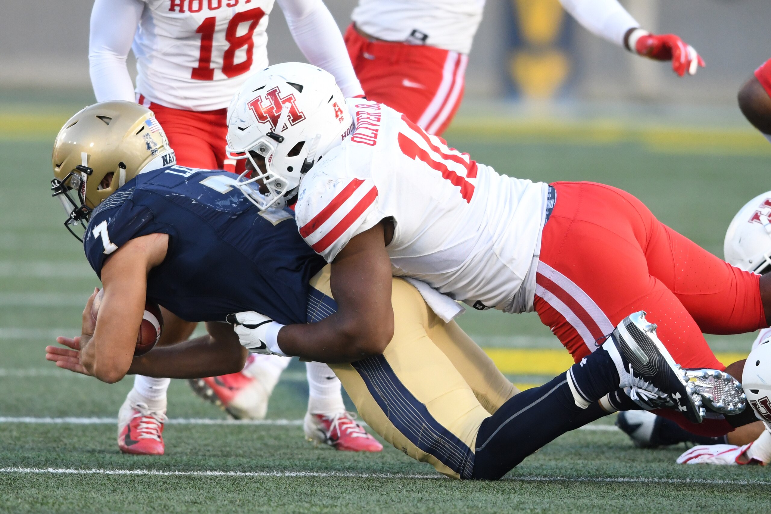 ANNAPOLIS, MD - OCTOBER 20:  Ed Oliver #10 of the Houston Cougars tackles Garret Lewis #7 of the Navy Midshipmen during a college football game at Navy-Marine Corps Memorial Stadium on October 20, 2018 in Annapolis, Maryland.  (Photo by Mitchell Layton/Ge