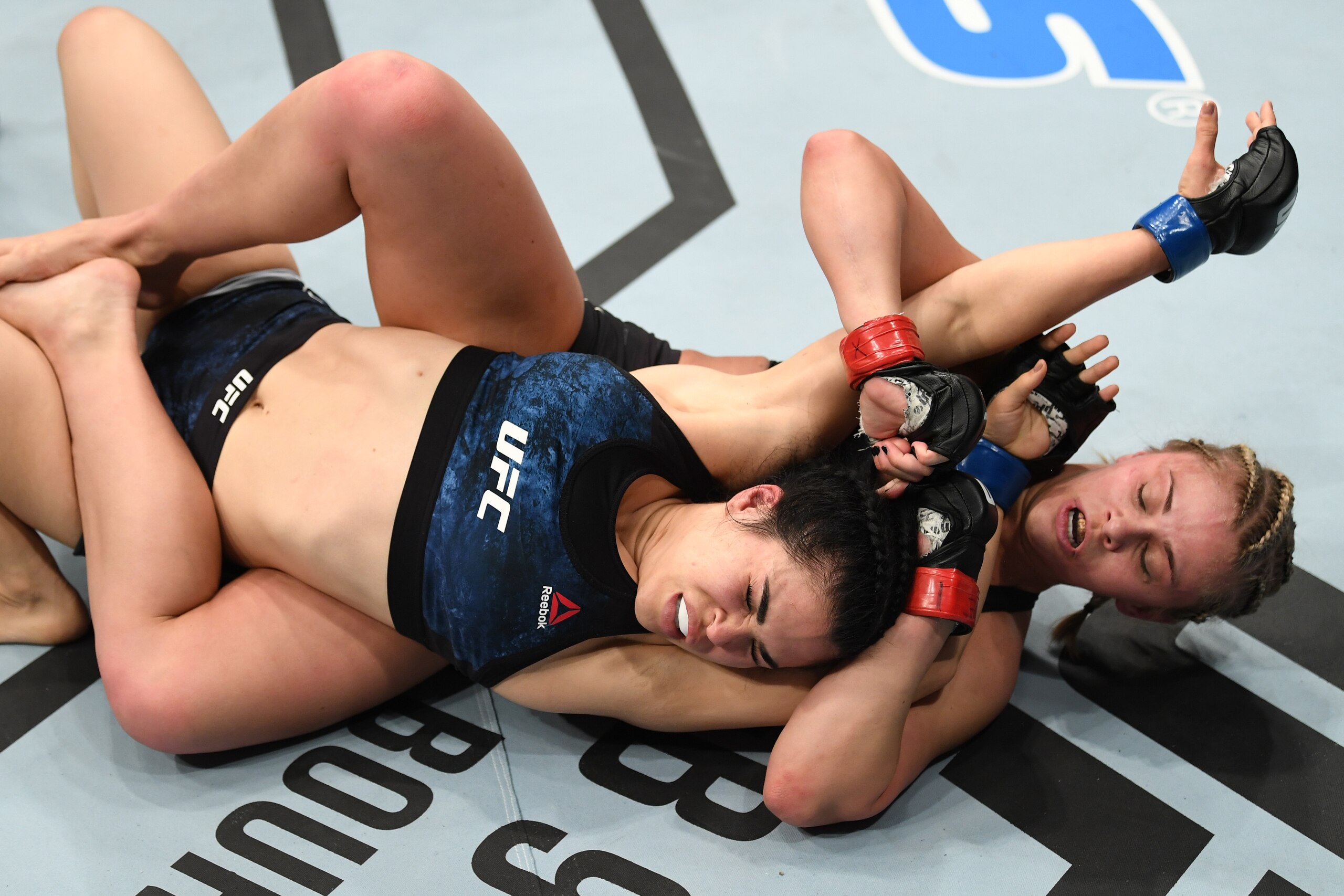 NEW YORK, NY - JANUARY 19:  (R-L) Paige VanZant attempts to submit Rachael Ostovich in their women's flyweight bout during the UFC Fight Night event at the Barclays Center on January 19, 2019 in the Brooklyn borough of New York City. (Photo by Josh Hedges
