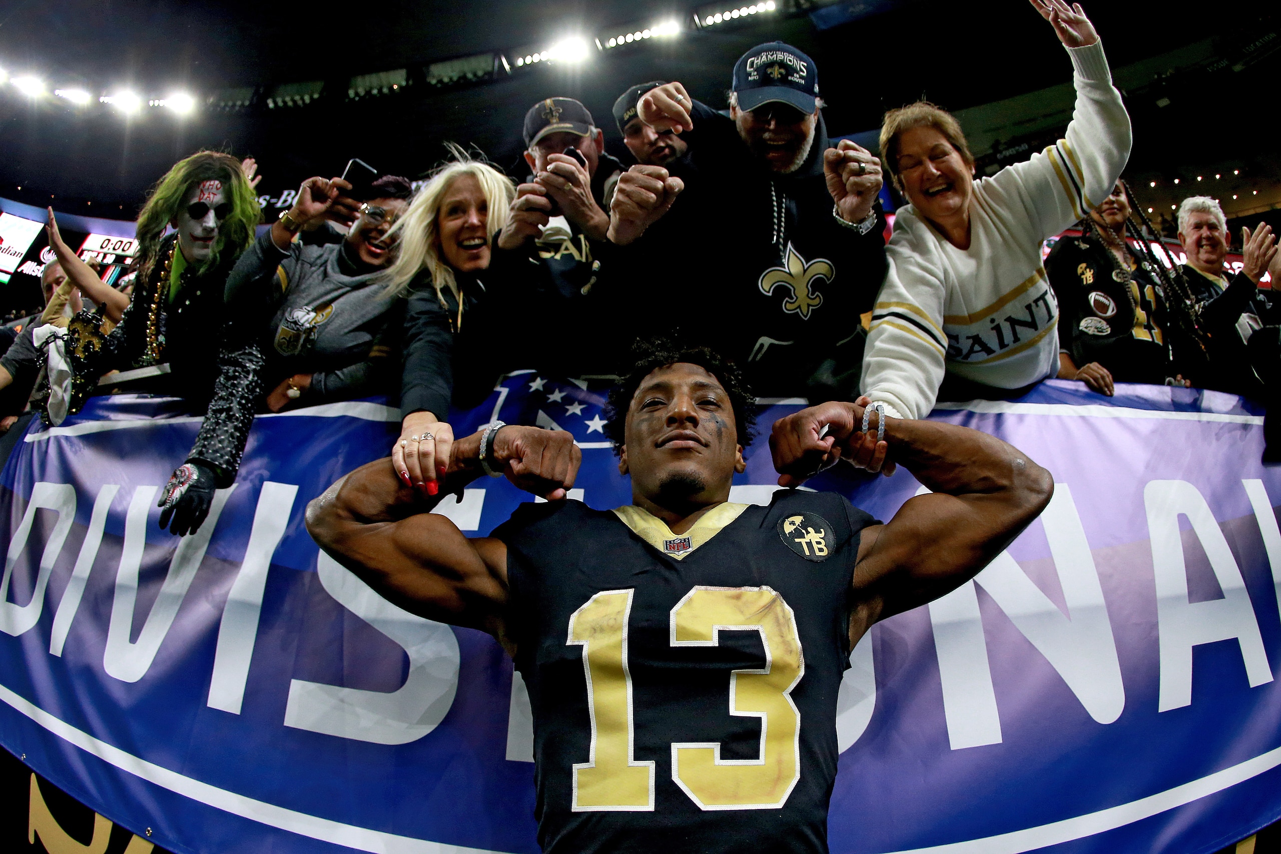 NEW ORLEANS, LOUISIANA - JANUARY 13:  Michael Thomas #13 of the New Orleans Saints posses for a photo with the fans after his teams win over the Philadelphia Eagles in the NFC Divisional Playoff Game at Mercedes Benz Superdome on January 13, 2019 in New O