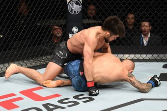 NEW YORK, NY - JANUARY 19:  (L-R) Henry Cejudo punches TJ Dillashaw in their flyweight bout during the UFC Fight Night event at the Barclays Center on January 19, 2019 in the Brooklyn borough of New York City. (Photo by Josh Hedges/Zuffa LLC/Zuffa LLC via