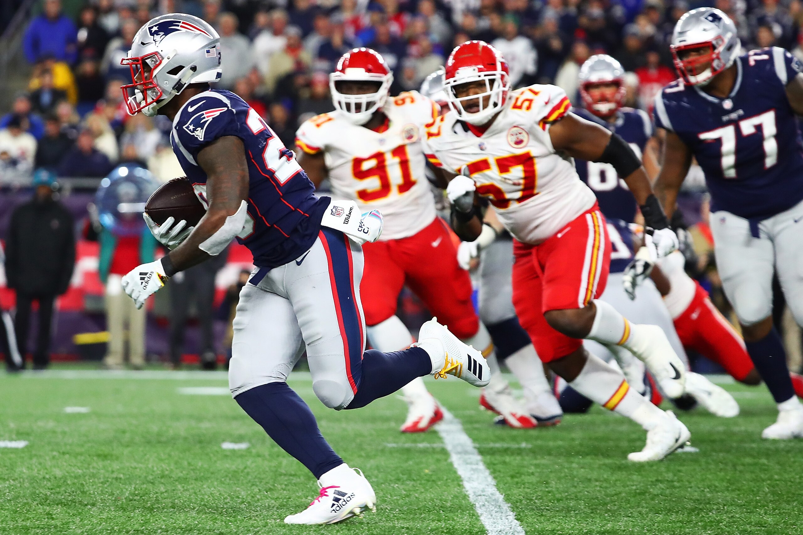 FOXBOROUGH, MA - OCTOBER 14:  Sony Michel #26 of the New England Patriots runs with the football during a game against the Kansas City Chiefs at Gillette Stadium on October 14, 2018 in Foxborough, Massachusetts.  (Photo by Adam Glanzman/Getty Images)