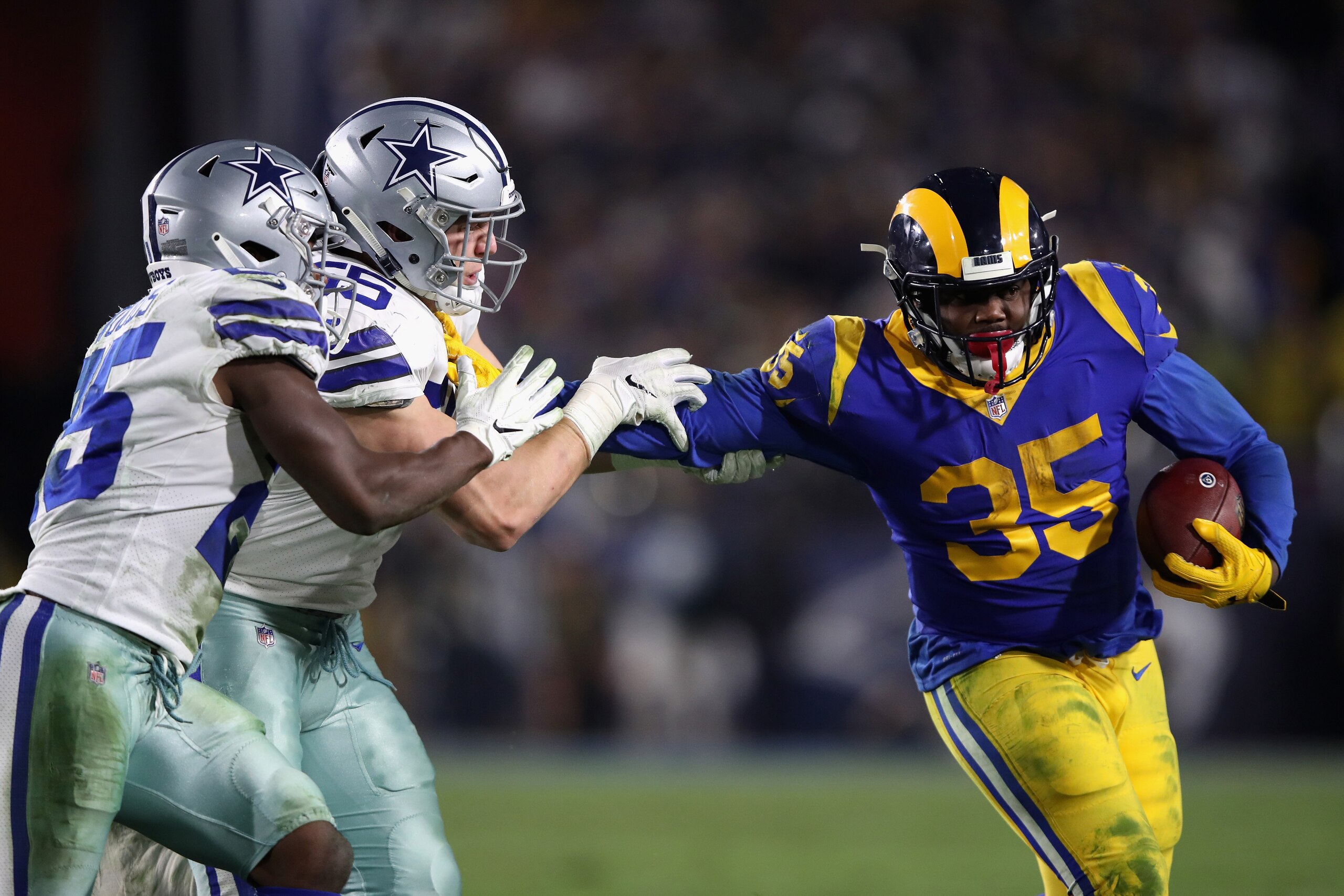 LOS ANGELES, CA - JANUARY 12:  C.J. Anderson #35 of the Los Angeles Rams runs the ball during  the NFC Divisional Playoff game against the Dallas Cowboys at Los Angeles Memorial Coliseum on January 12, 2019 in Los Angeles, California. The Rams defeated th