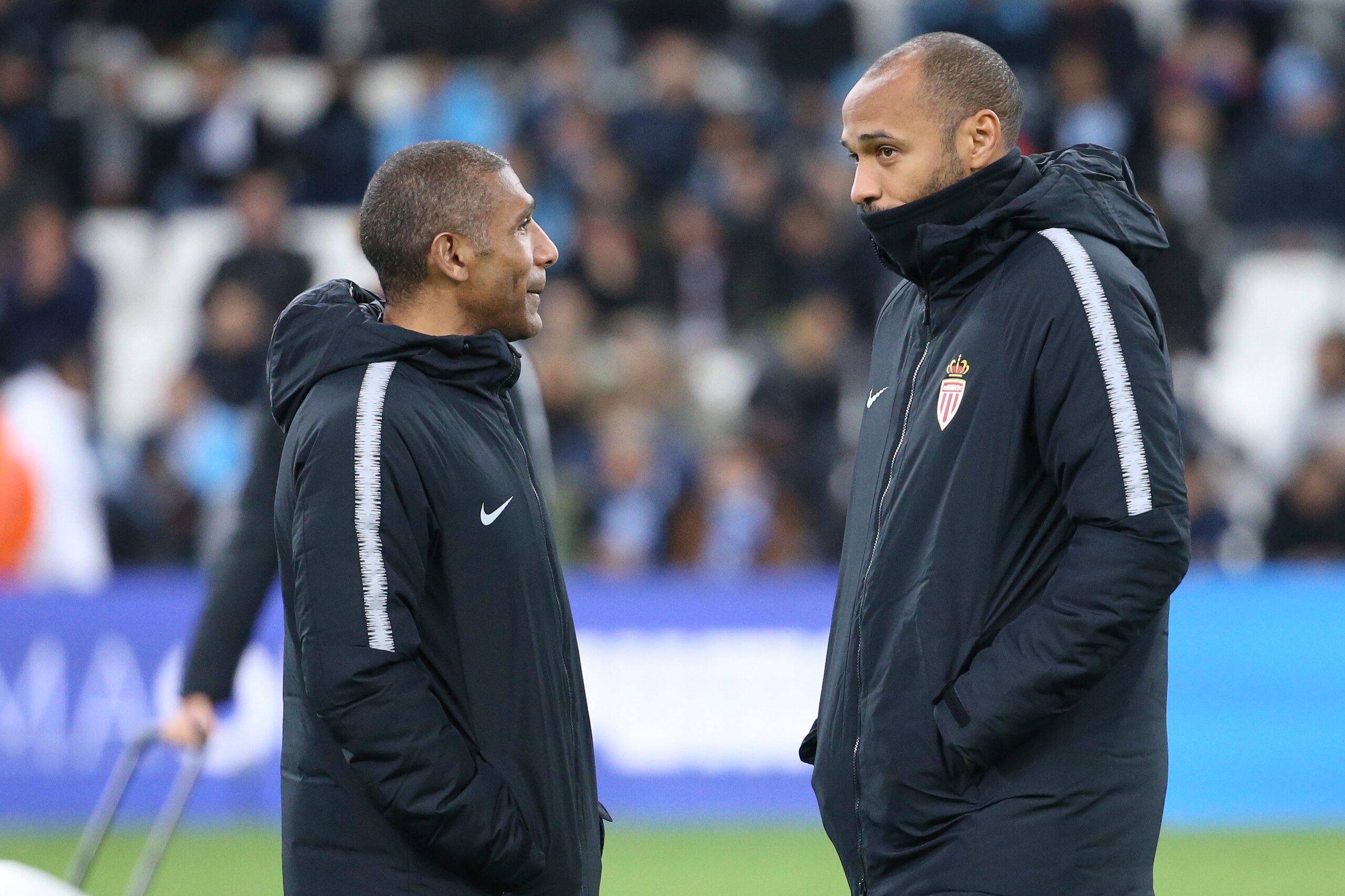 MARSEILLE, FRANCE - JANUARY 13: Coach of Monaco Thierry Henry and his assistant-coach Franck Passi (left) during the french Ligue 1 match between Olympique de Marseille (OM) and AS Monaco at Stade Velodrome on January 13, 2019 in Marseille, France. (Photo