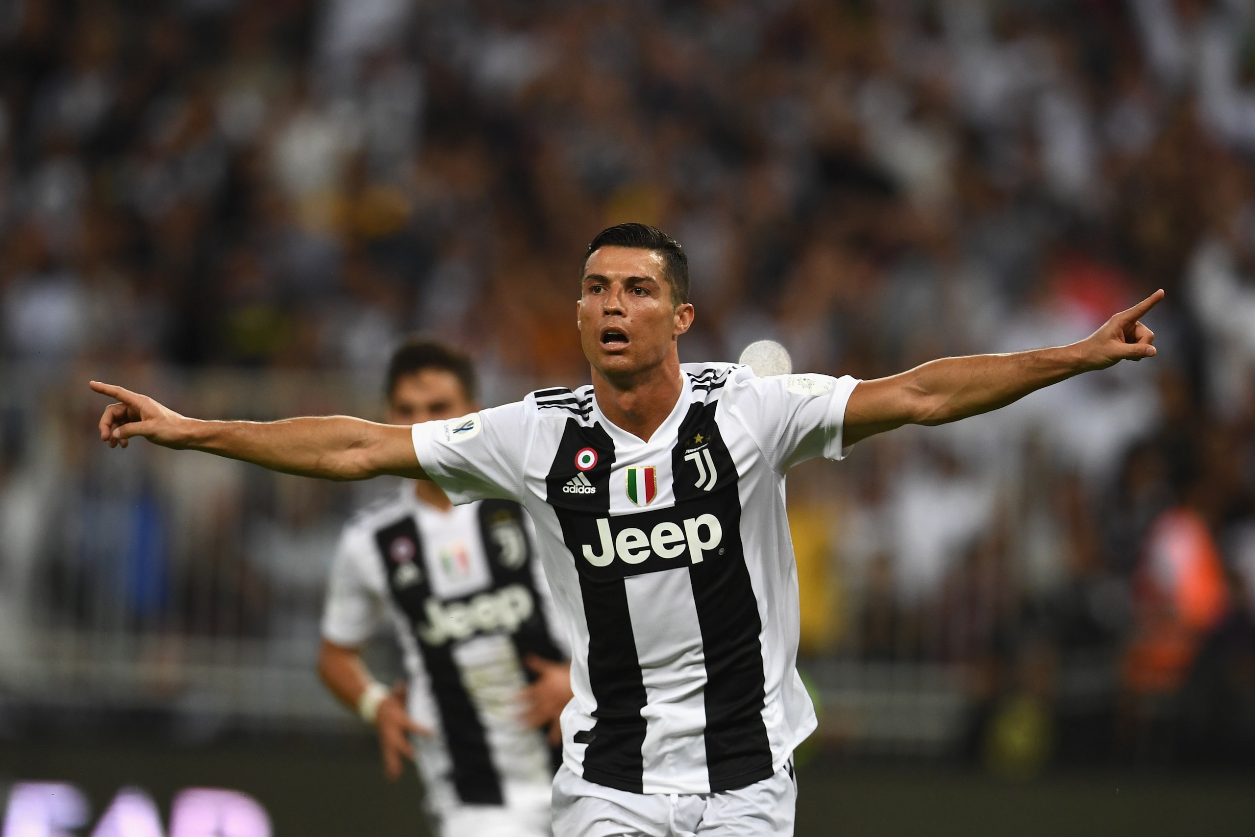 JEDDAH, SAUDI ARABIA - JANUARY 16:  Cristiano Ronaldo of Juventus celebrates after scoring his sides first goal during the Italian Supercup match between Juventus and AC Milan at King Abdullah Sports City on January 16, 2019 in Jeddah, Saudi Arabia.  (Pho