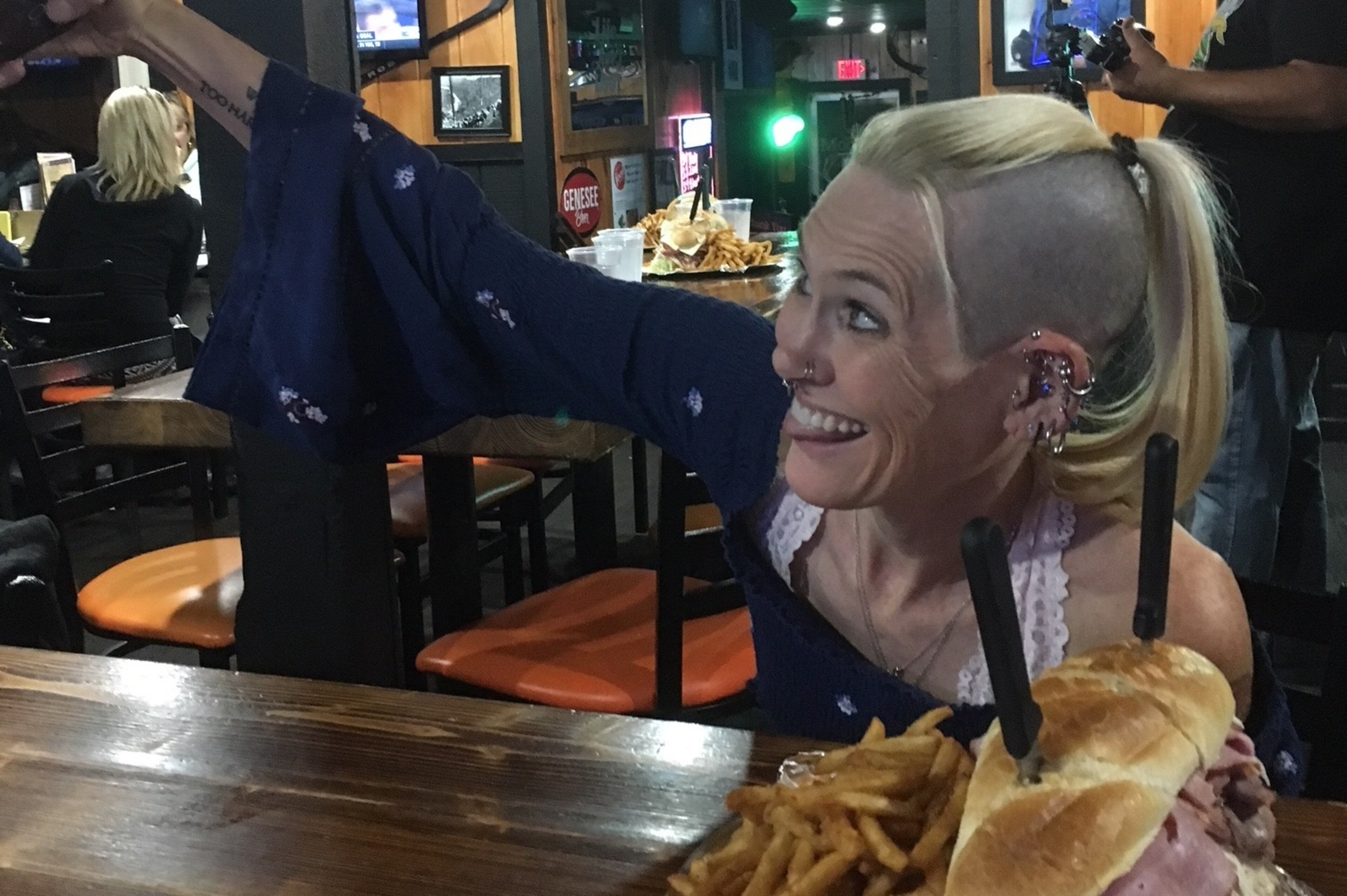 Schuyler takes a selfie with the sandwich.