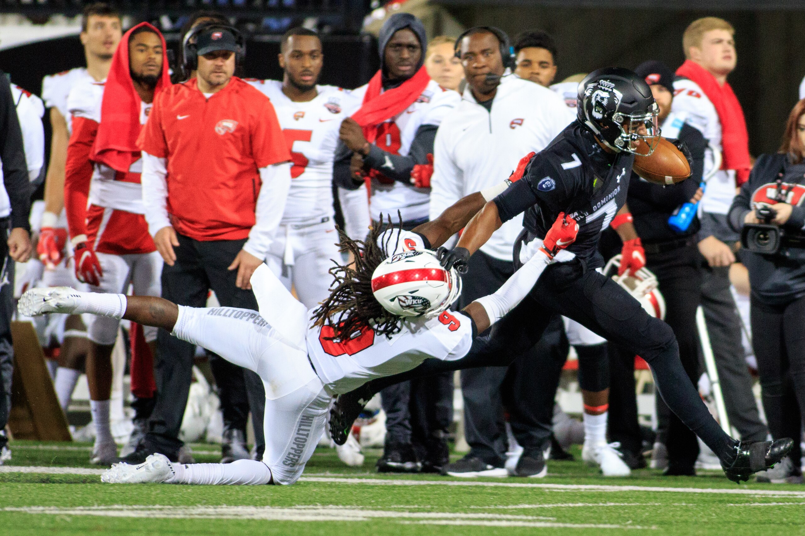BOWLING GREEN, KY - OCTOBER 20: Oshane Ximines #7 of the Old Dominion Monarchs is chased down by Xavier Lane #9 of the Western Kentucky Hilltoppers on October 20, 2018 in Bowling Green, Kentucky. (Photo by Justin Casterline/Getty Images)