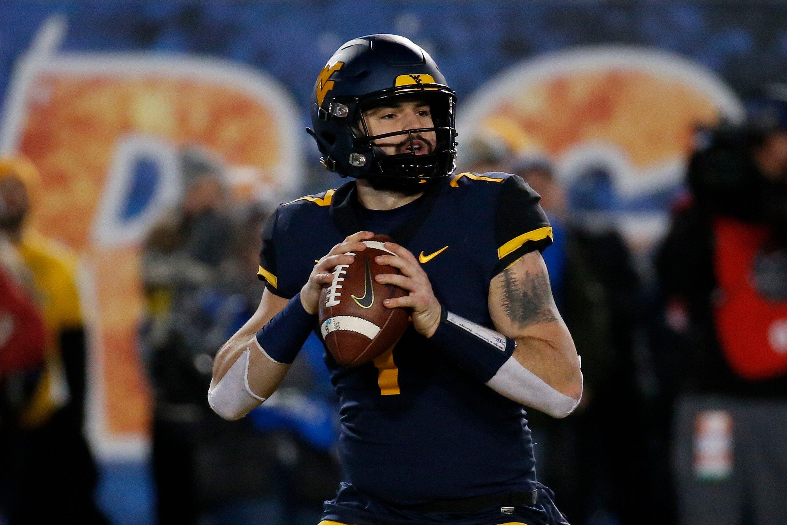 MORGANTOWN, WV - NOVEMBER 23:  Will Grier #7 of the West Virginia Mountaineers in action against the Oklahoma Soonersrs on November 23, 2018 at Mountaineer Field in Morgantown, West Virginia.  (Photo by Justin K. Aller/Getty Images)