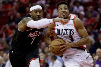 HOUSTON, TX - OCTOBER 30:  CJ McCollum #3 of the Portland Trail Blazers drives past Carmelo Anthony #7 of the Houston Rockets in the first quarter at Toyota Center on October 30, 2018 in Houston, Texas. NOTE TO USER: User expressly acknowledges and agrees