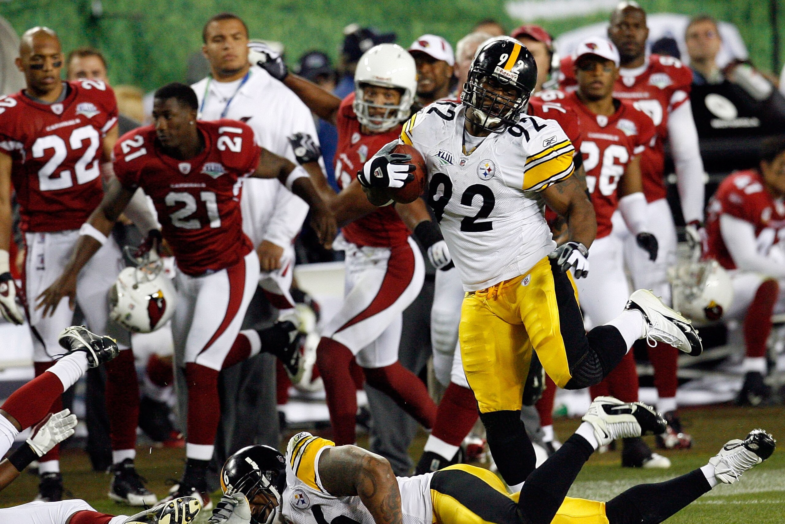 TAMPA, FL - FEBRUARY 01:  James Harrison #92 of the Pittsburgh Steelers returns an interception 100-yards for a touchdown in the second quarter against the Arizona Cardinals during Super Bowl XLIII on February 1, 2009 at Raymond James Stadium in Tampa, Fl
