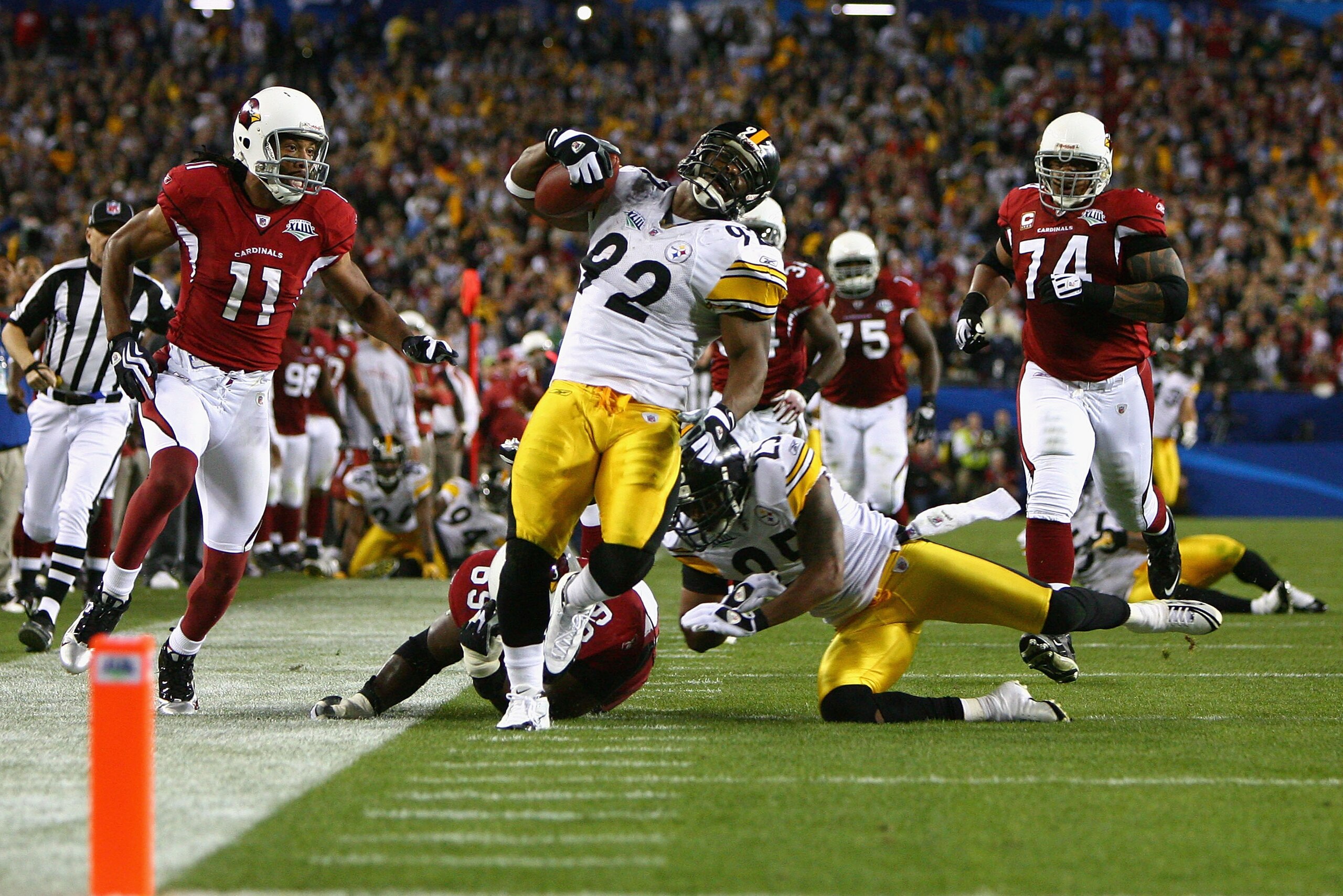 TAMPA, FL - FEBRUARY 01:  James Harrison #92 of the Pittsburgh Steelers runs back an interception for a touchdown in the second quarter against the Arizona Cardinals during Super Bowl XLIII on February 1, 2009 at Raymond James Stadium in Tampa, Florida.  