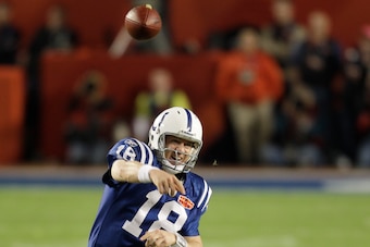 Peyton releasing the historic pass that winds up in the arms of Porter.