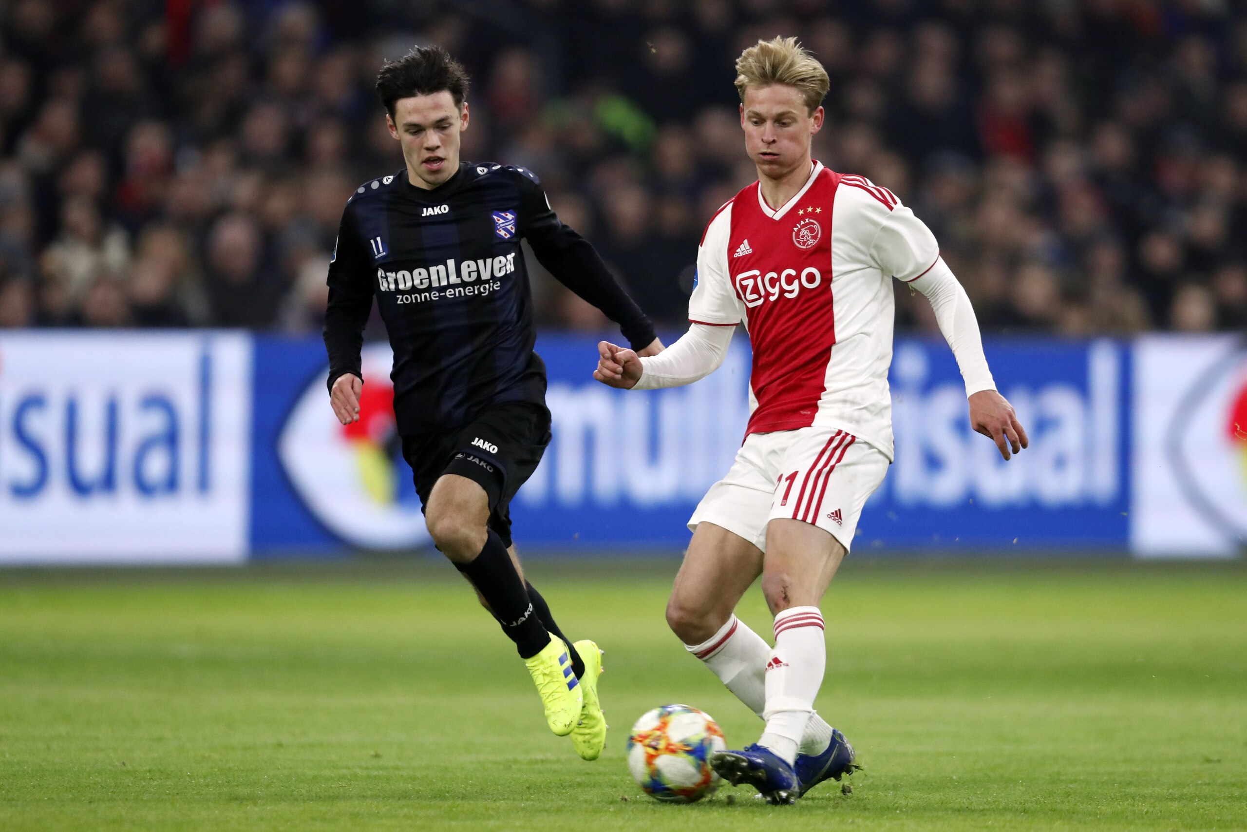 (l-r) Mitchell van Bergen of sc Heerenveen, Frenkie de Jong of Ajax during the Dutch Eredivisie match between Ajax Amsterdam and sc Heerenveen at the Johan Cruijff Arena on January 20, 2019 in Amsterdam, The Netherlands(Photo by VI Images via Getty Images