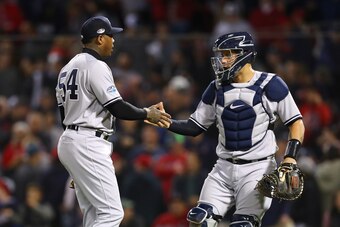 BOSTON, MA - OCTOBER 06:  Catcher Gary Sanchez #24 of the New York Yankees congratulates closing pitcher Aroldis Chapman #54  after their 6-2 win in Game Two of the American League Division Series against the Boston Red Sox at Fenway Park on October 6, 20