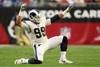 GLENDALE, ARIZONA - DECEMBER 23:  Defensive end Aaron Donald #99 of the Los Angeles Rams celebrates after a sack 
against the Arizona Cardinals during the second half of the NFL game at State Farm Stadium on December 23, 2018 in Glendale, Arizona. The Ram